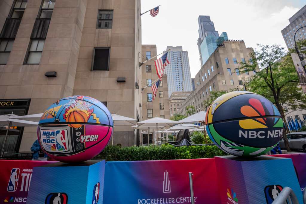 Two oversized NBA on NBC basketball sculptures outside Rockefeller Center.