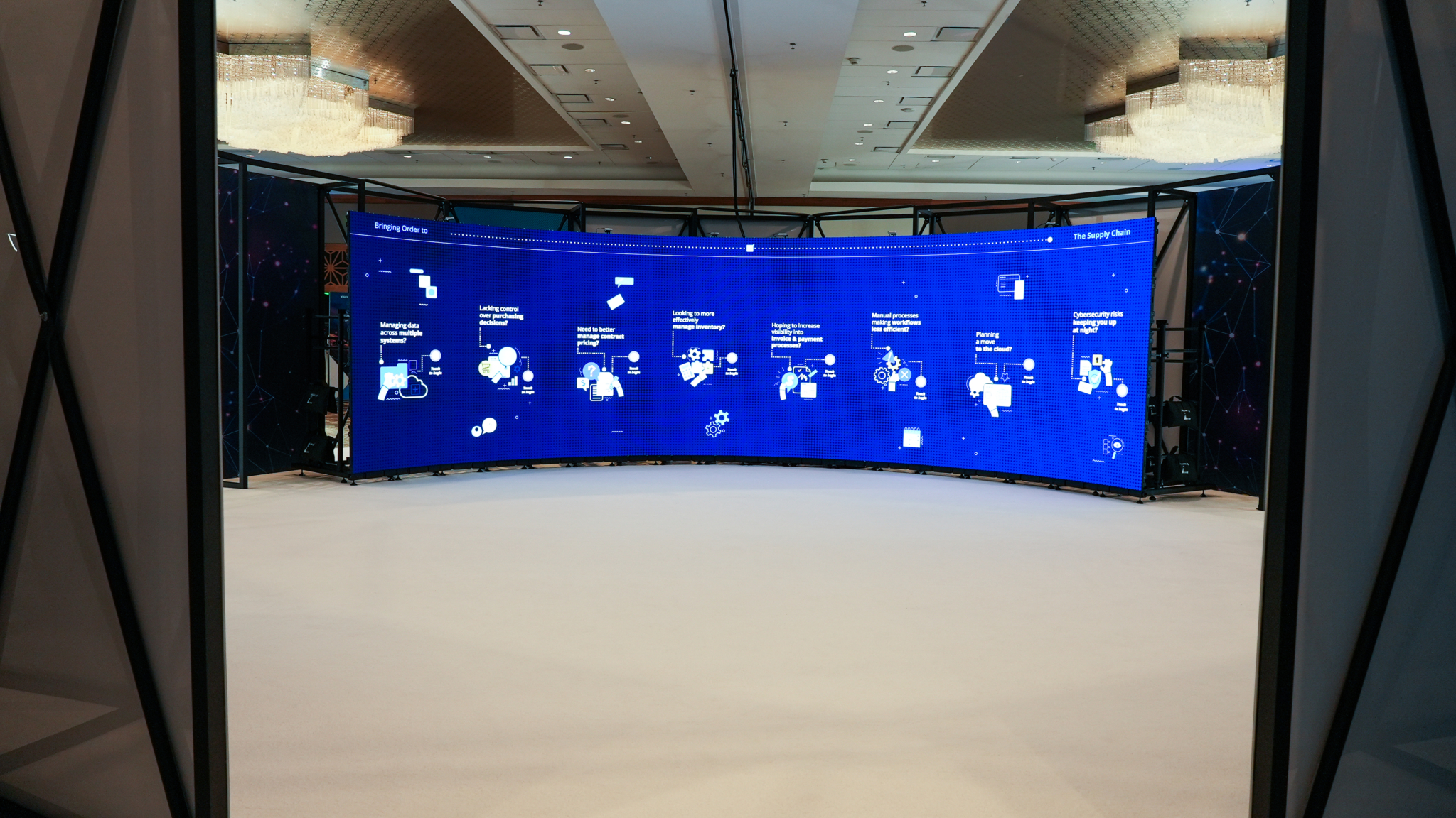 A curved blue display in the GHX Summit event space.