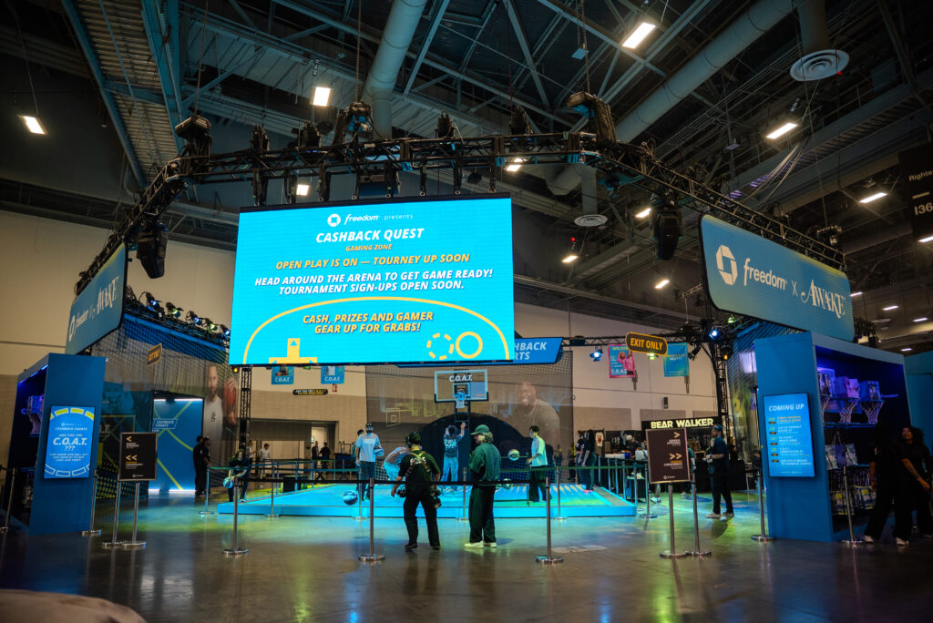 A suspended screen and surrounding displays above the Chase ComplexCon court.