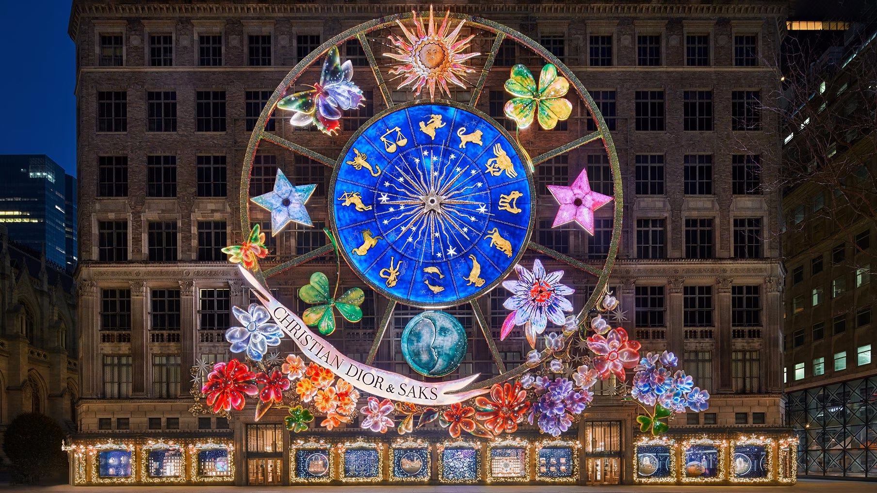 A large illuminated Dior holiday installation covers the facade of Saks Fifth Avenue.