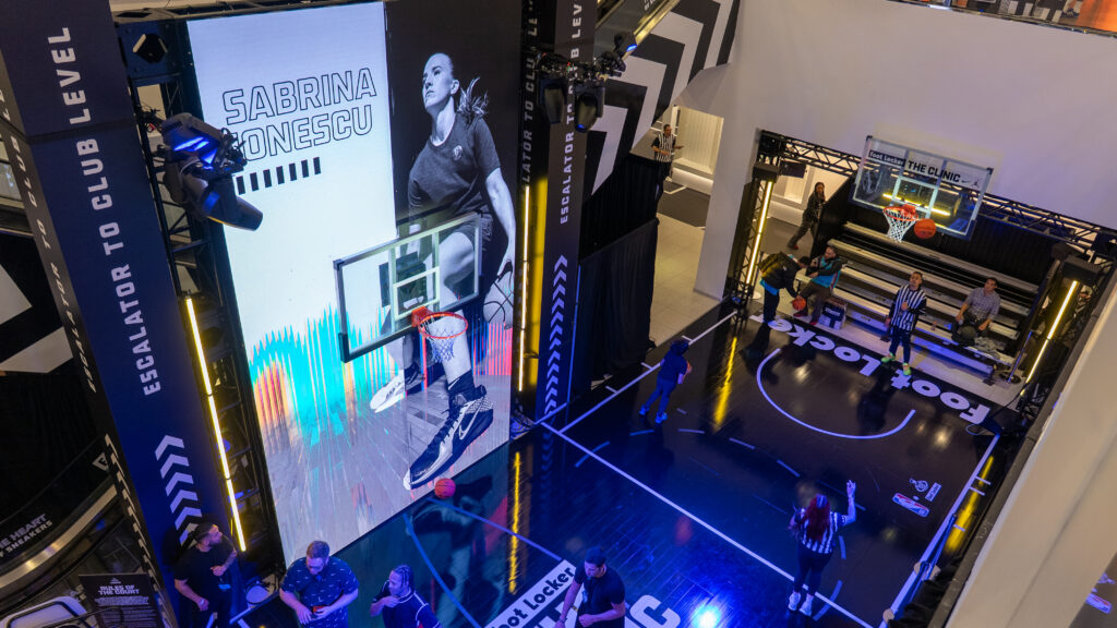 An elevated view of tall Foot Locker displays and the basketball activity area.