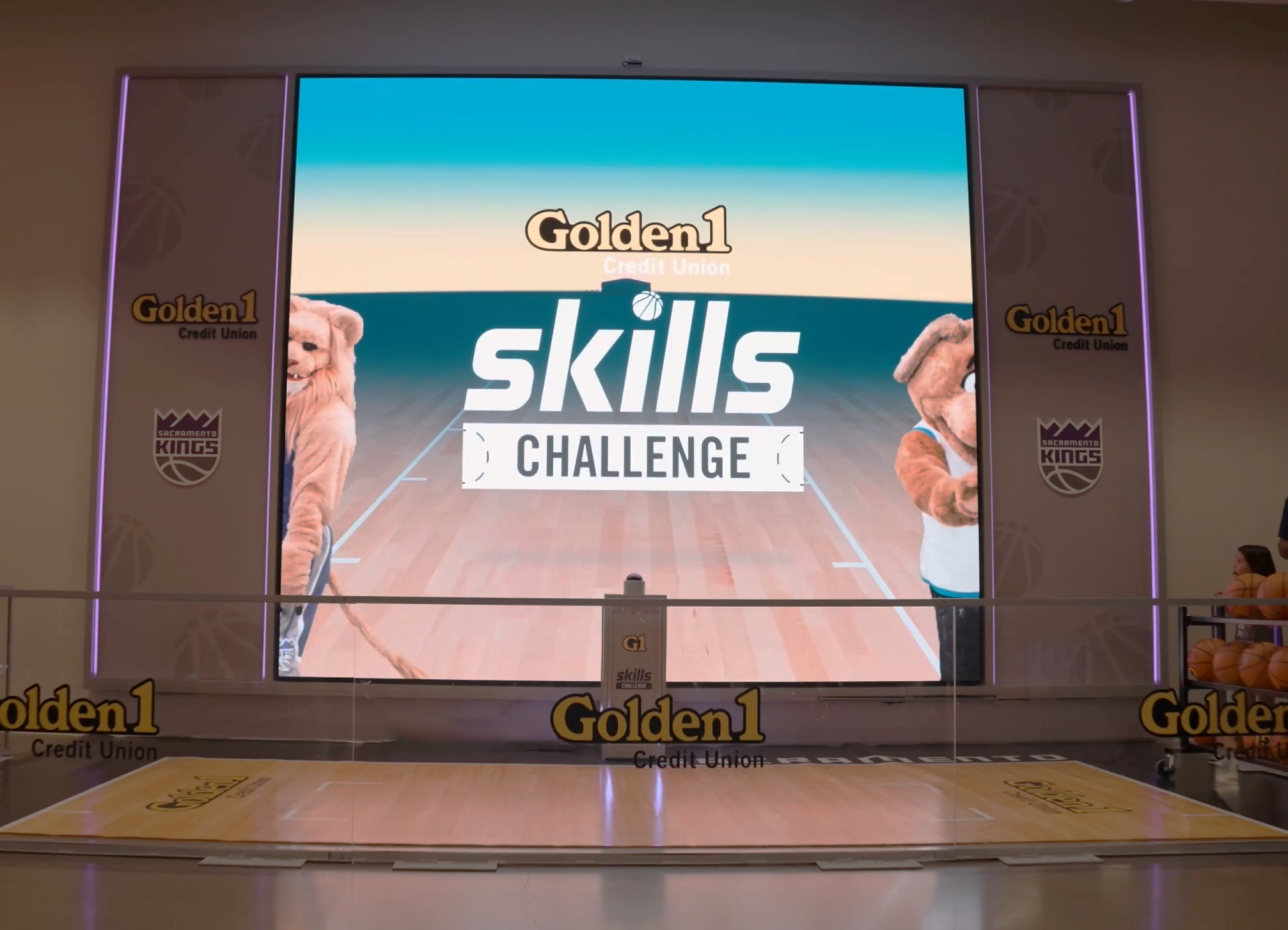 A Golden 1 Skills Challenge display and basketball activity area.