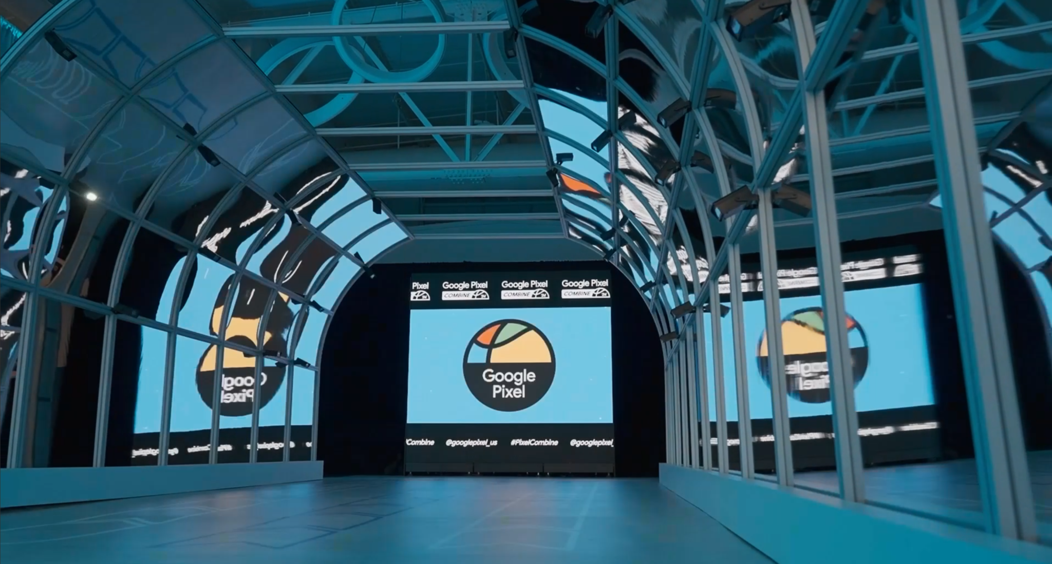 A Google Pixel-branded basketball activity space framed by an illuminated structure.