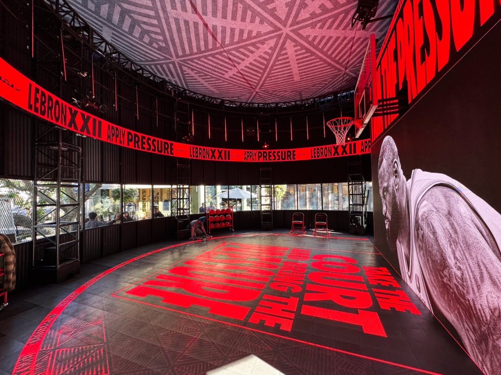 Red graphics cover the floor and surrounding displays in the LeBron x Nike experience.