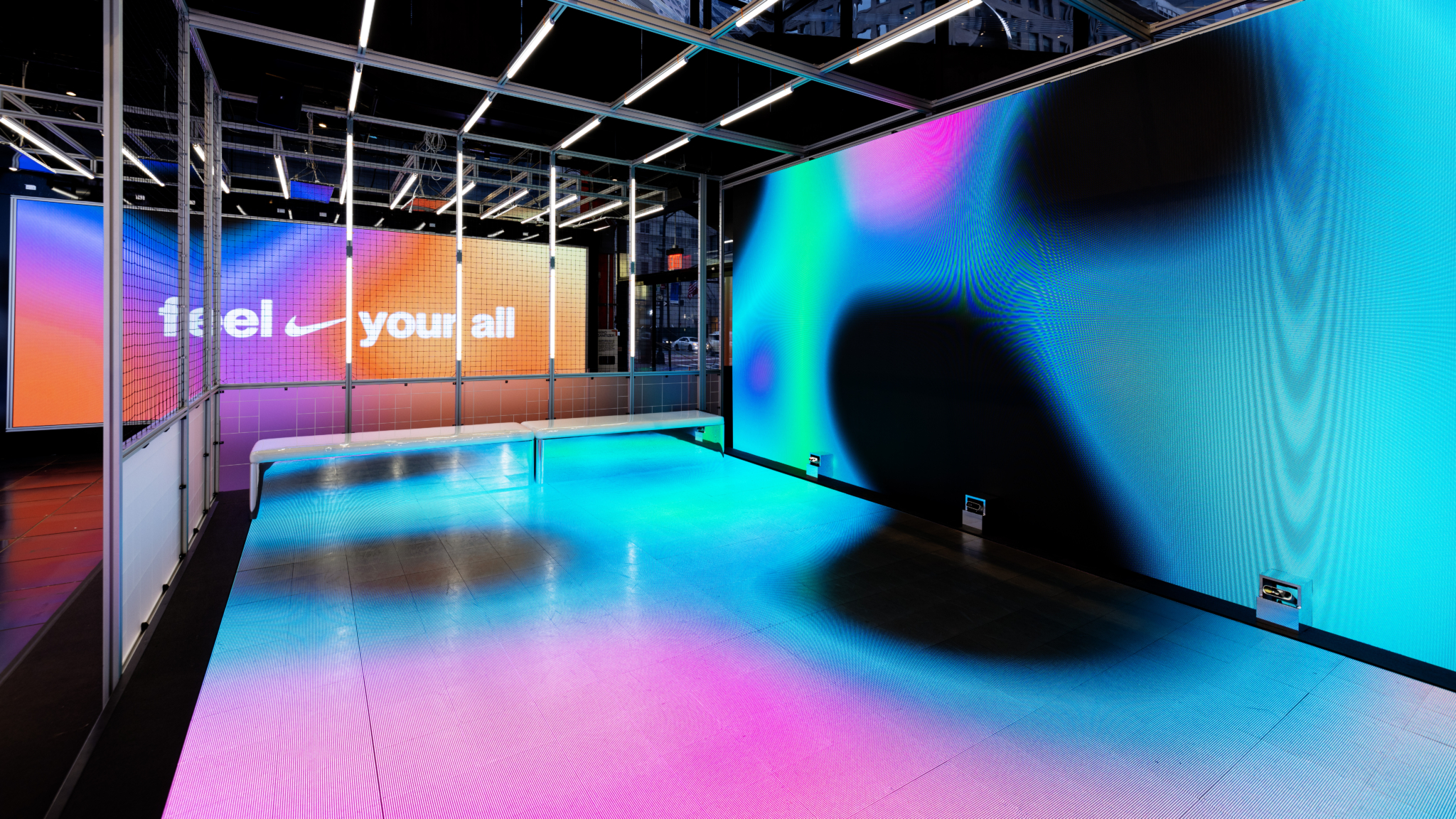 Colorful floor-to-ceiling displays line the Nike Future Fitness space.