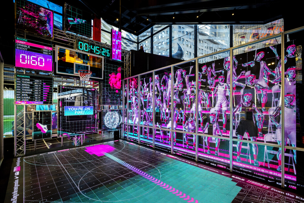 Colorful digital displays and basketball imagery fill the Nike LeBron retail installation.