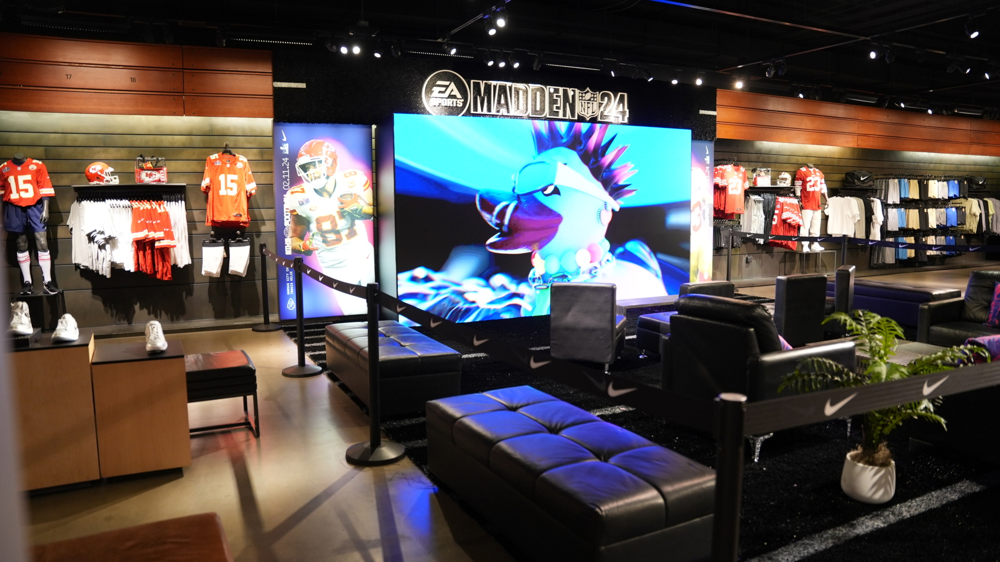 An EA Madden screen and lounge seating inside a Nike retail space.