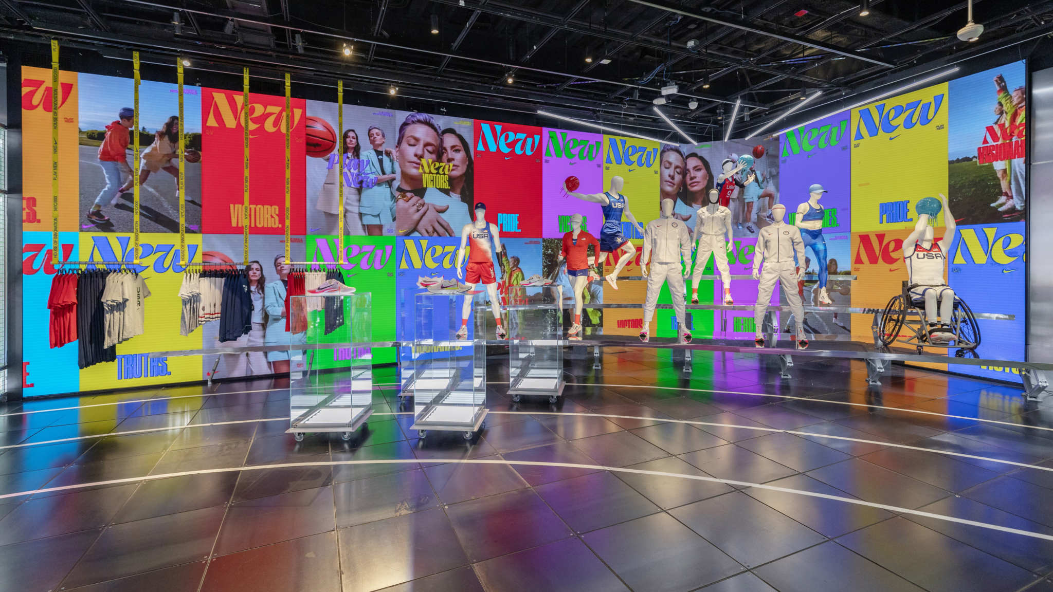 Bright athlete imagery wraps around the Nike Olympics retail installation.